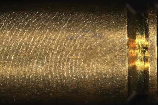 Detail of an untreated fingerprint on a cartridge case surface. image
